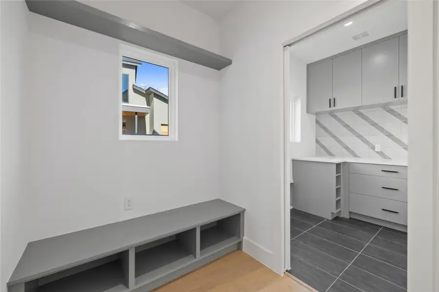 Mudroom featuring dark tile patterned flooring