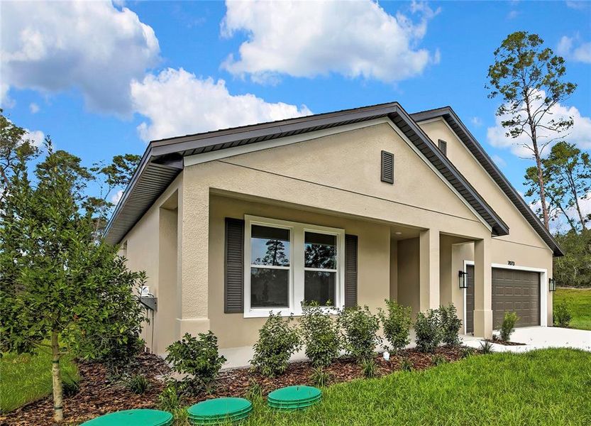 Front exterior of a new home in , Weeki Wachee, FL, highlighting curb appeal (Image 28). Front exterior of a new home in , Weeki Wachee, FL, highlighting curb appeal (Image 28).