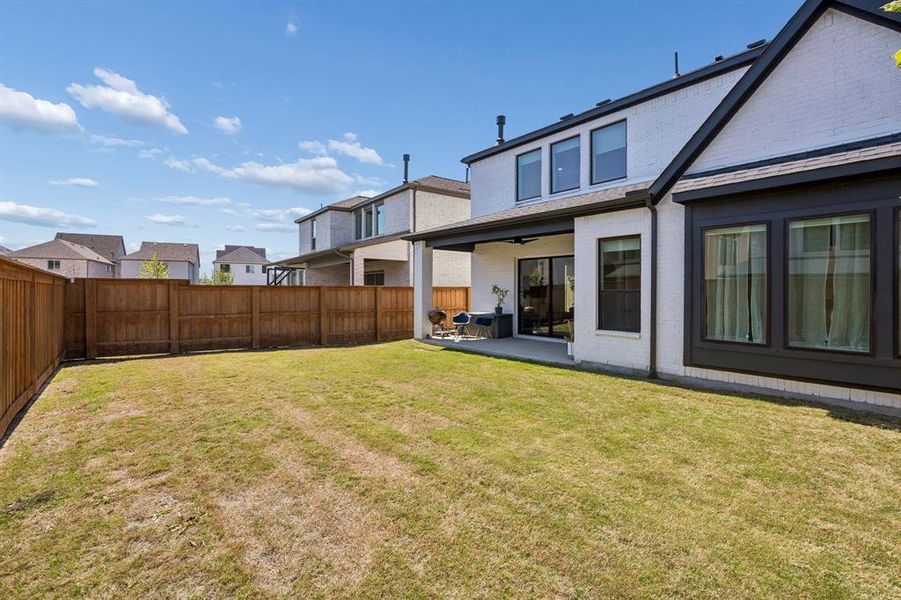 Exterior details and patio area of a home in Fields 50', Frisco (Image 23). Exterior details and patio area of a home in Fields 50', Frisco (Image 23).