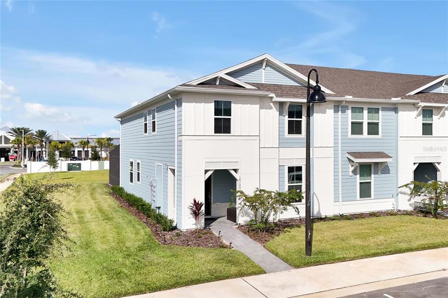 Front exterior of a new home in , Clermont, FL, highlighting curb appeal (Image 1).