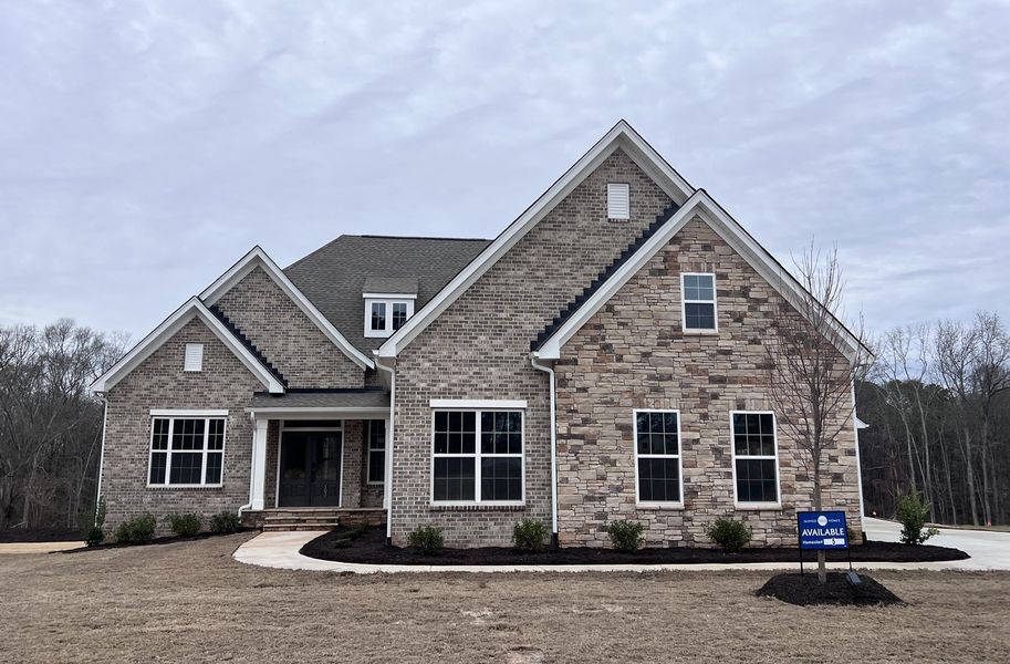 Front exterior of a new home in Walnut Grove, Easley, SC, highlighting curb appeal (Image 1).
