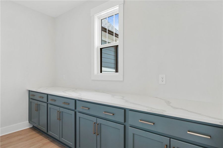 Streamlined cabinetry and pristine countertops off Streamlined cabinetry and pristine countertops off