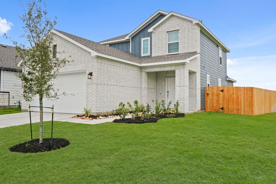 Front exterior of a new home in Valor Park, Bay City, TX, highlighting curb appeal (Image 13). Front exterior of a new home in Valor Park, Bay City, TX, highlighting curb appeal (Image 13).