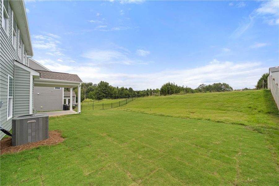 Exterior details and patio area of a home in Twin Lakes, Hoschton (Image 18).
