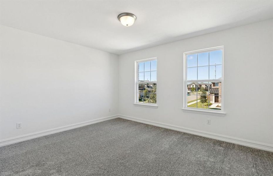 Spacious secondary bedroom with large windows Spacious secondary bedroom with large windows