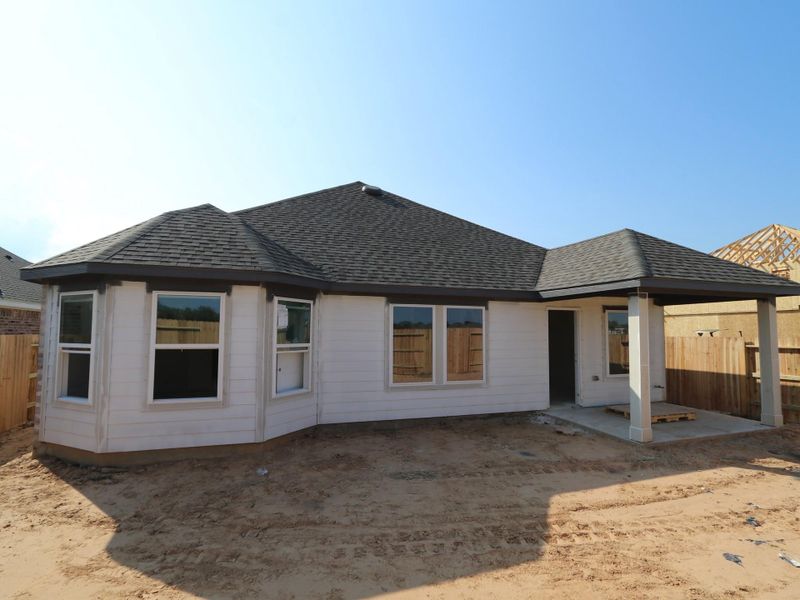 Front exterior of a new home in Lago Mar, Santa Fe, TX, highlighting curb appeal (Image 13). Front exterior of a new home in Lago Mar, Santa Fe, TX, highlighting curb appeal (Image 13).
