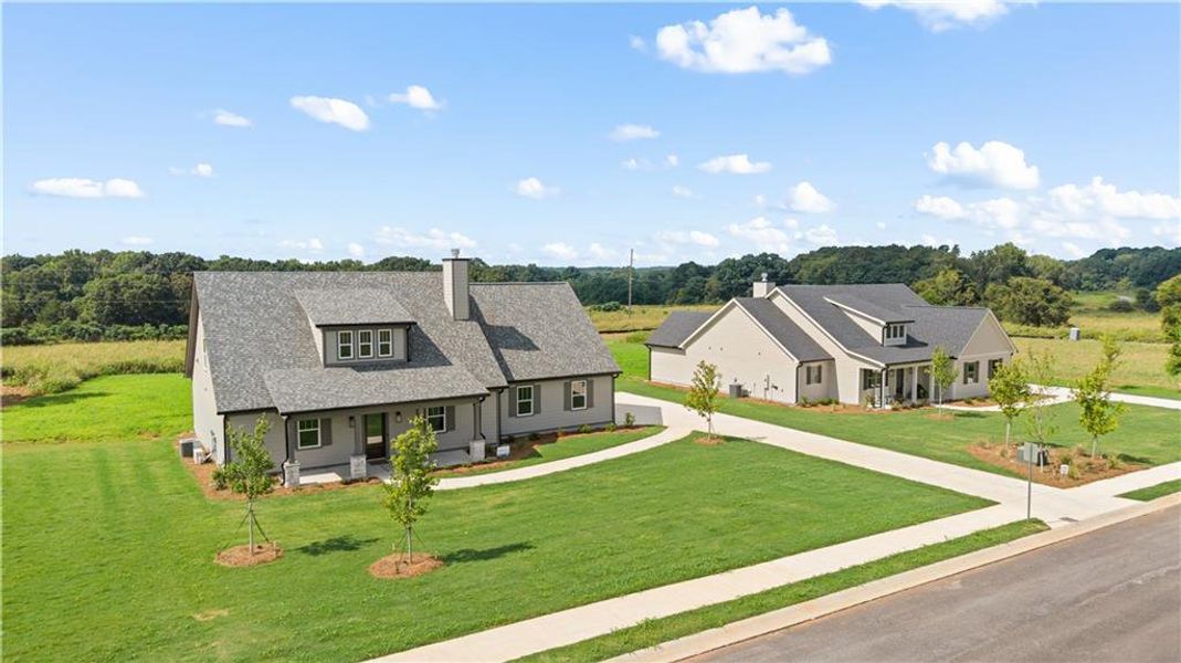 Front exterior of a new home in , Madison, GA, highlighting curb appeal (Image 1). Front exterior of a new home in , Madison, GA, highlighting curb appeal (Image 1).