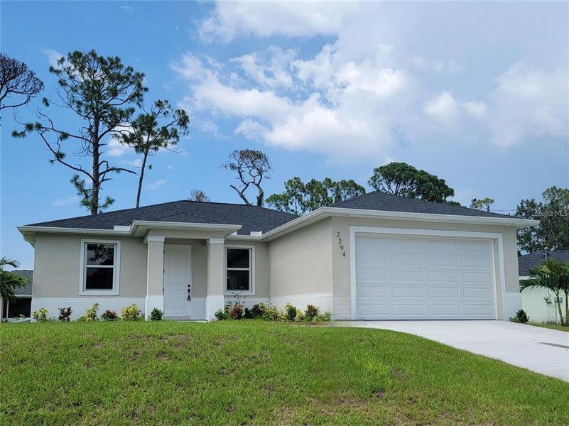 Front exterior of a new home in , North Port, FL, highlighting curb appeal (Image 18).