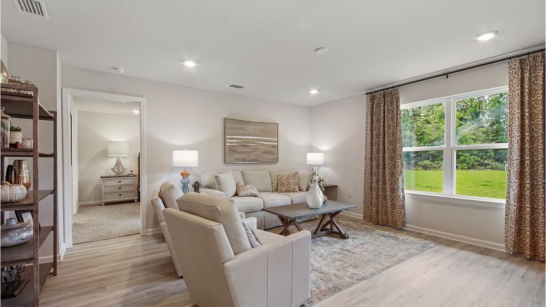 Representative furnished interior of a home built from the Cali by D.R. Horton in Owl's Head East, Freeport (Image 12).