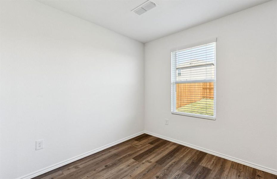 Dining nook off kitchen with large windows