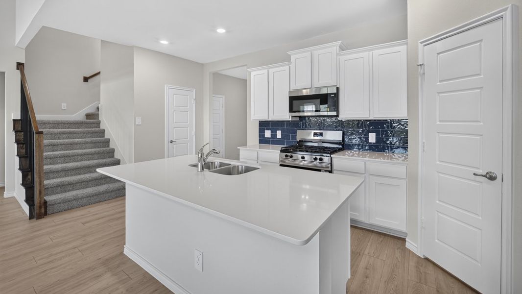 Representative furnished interior of a home built from the H231 Copaiba by D.R. Horton in Lilybrooke at Legacy Hills, Celina (Image 6).