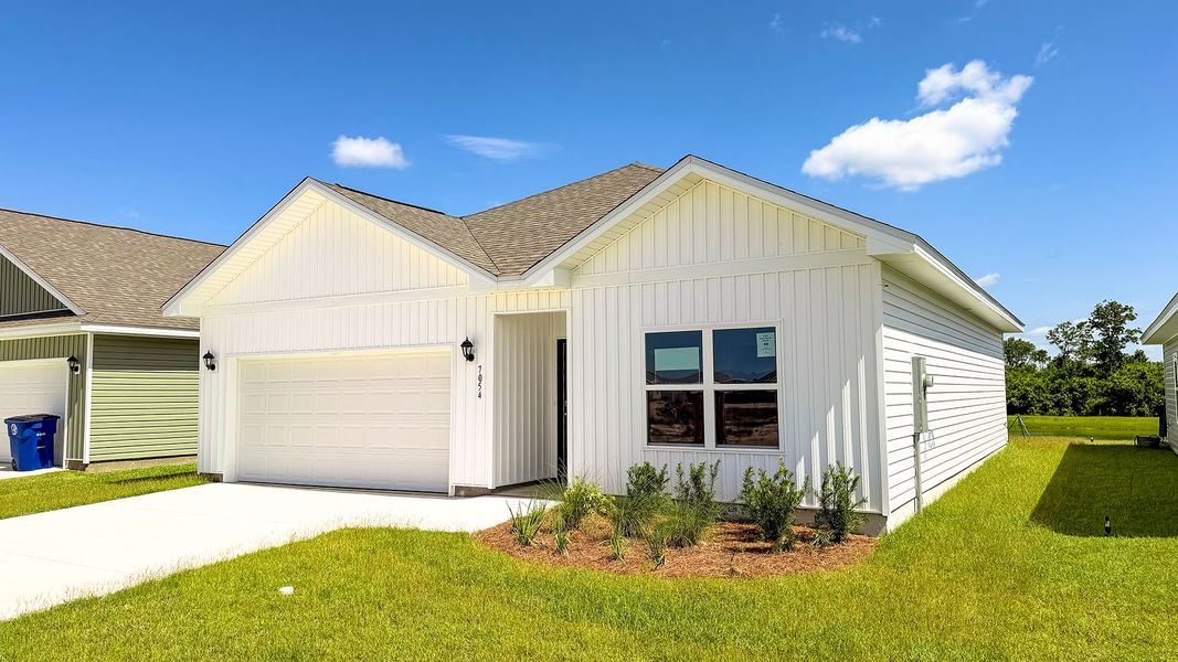 Front exterior of a new home in Liberty, Panama City, FL, highlighting curb appeal (Image 2). Front exterior of a new home in Liberty, Panama City, FL, highlighting curb appeal (Image 2).