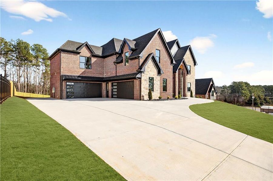 Front exterior of a new home in , Buford, GA, highlighting curb appeal (Image 34). Front exterior of a new home in , Buford, GA, highlighting curb appeal (Image 34).