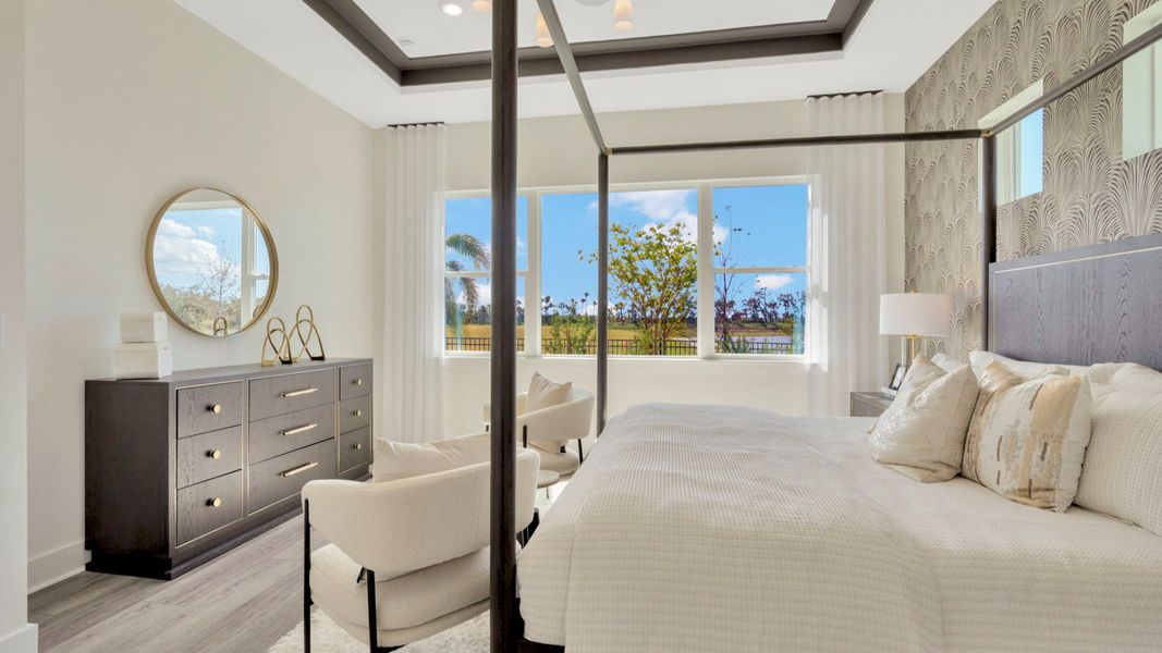 The Primary Bedroom of a DRB Homes Grand Eider model, which is a home plan offered at Serengeti in Spring Hill, FL.