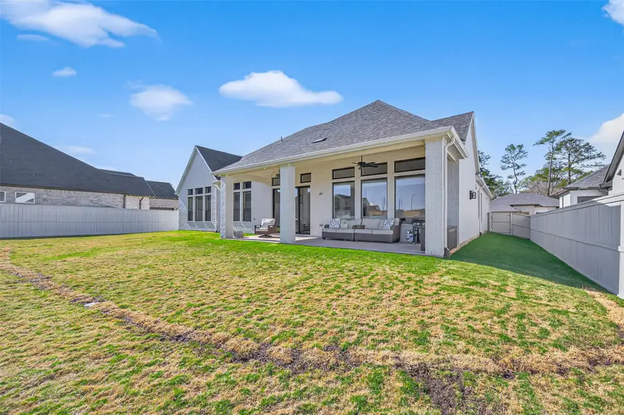 Exterior details and patio area of a home in , Magnolia (Image 3). Exterior details and patio area of a home in , Magnolia (Image 3).