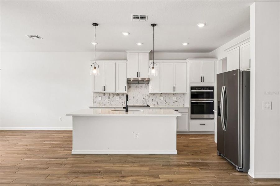 Furnished interior view inside a new home in The Grove at Stuart Crossing - Signature Series, Bartow (Image 10).