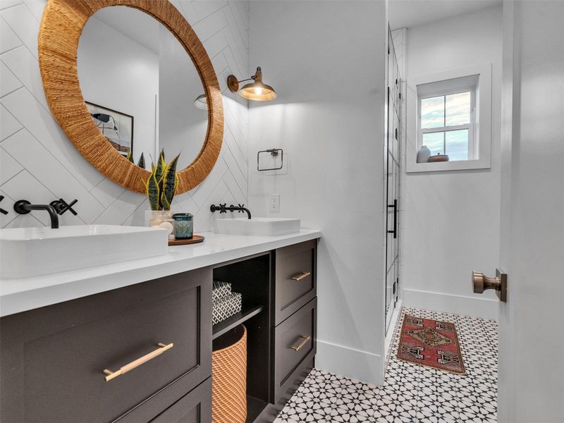 Wake up to coastal serenity in this bright and beautifully appointed bathroom. Dual sinks, a spacious vanity, and a sleek glass-enclosed shower make everyday routines effortless. It’s the perfect space to start your morning energized or unwind after a long day. Designed with comfort and flow in mind, it brings a refreshing sense of calm that makes living by the beach feel as easy as the breeze outside. Wake up to coastal serenity in this bright and beautifully appointed bathroom. Dual sinks, a spacious vanity, and a sleek glass-enclosed shower make everyday routines effortless. It’s the perfect space to start your morning energized or unwind after a long day. Designed with comfort and flow in mind, it brings a refreshing sense of calm that makes living by the beach feel as easy as the breeze outside.