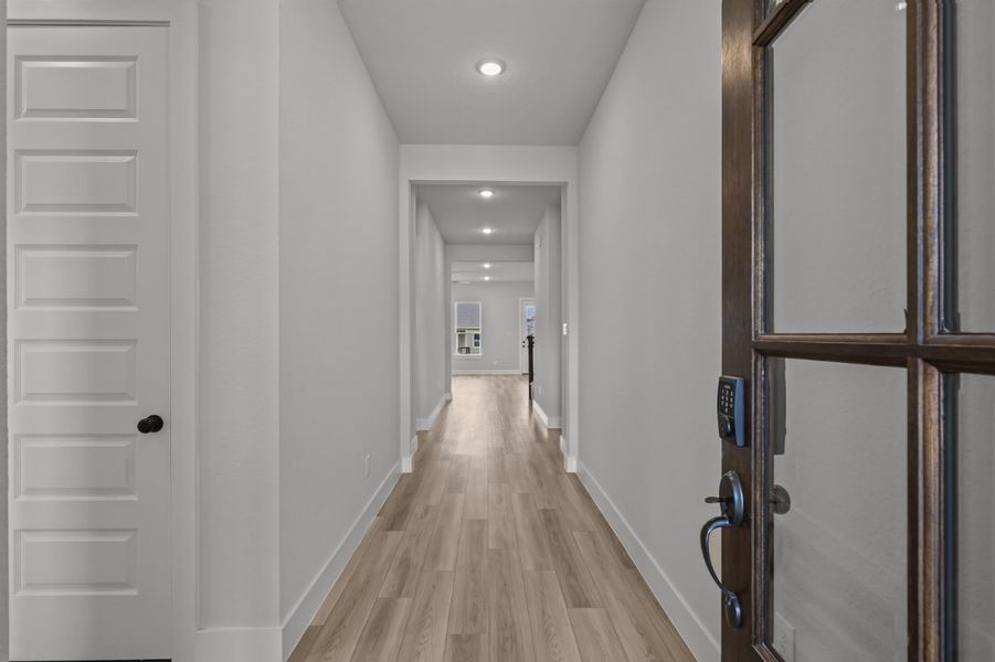 A hallway with white doors. A hallway with white doors.