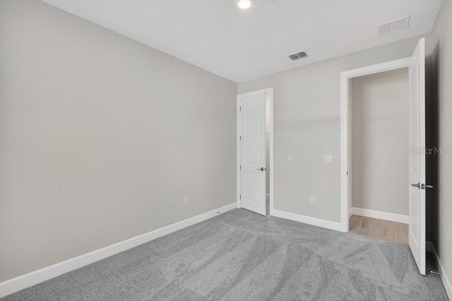 Spacious, unfurnished interior of a new home in Esplanade at Wiregrass Ranch, Wesley Chapel (Image 32).