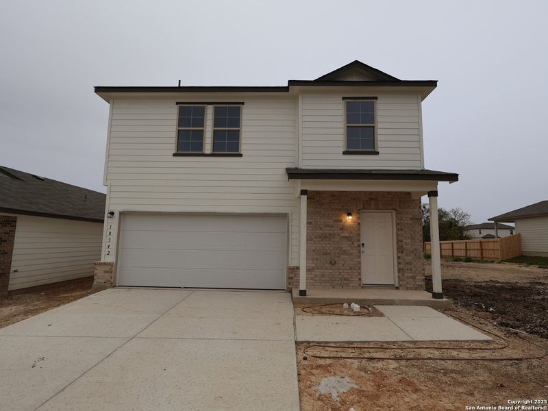 Front exterior of a new home in Paloma Park, Converse, TX, highlighting curb appeal (Image 1). Front exterior of a new home in Paloma Park, Converse, TX, highlighting curb appeal (Image 1).