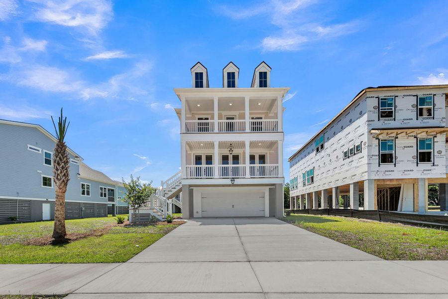 Front exterior of a new home in Miller's Crossing, Johns Island, SC, highlighting curb appeal (Image 2). Front exterior of a new home in Miller's Crossing, Johns Island, SC, highlighting curb appeal (Image 2).