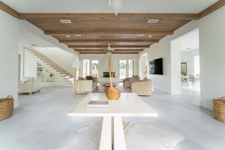 Dining area with french doors, finished concrete flooring, and recessed lighting Dining area with french doors, finished concrete flooring, and recessed lighting