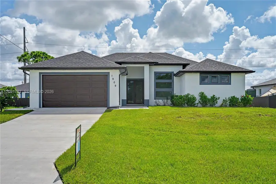 Front exterior of a new home in , Cape Coral, FL, highlighting curb appeal (Image 2). Front exterior of a new home in , Cape Coral, FL, highlighting curb appeal (Image 2).