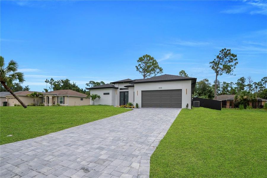 Front exterior of a new home in , North Port, FL, highlighting curb appeal (Image 22). Front exterior of a new home in , North Port, FL, highlighting curb appeal (Image 22).