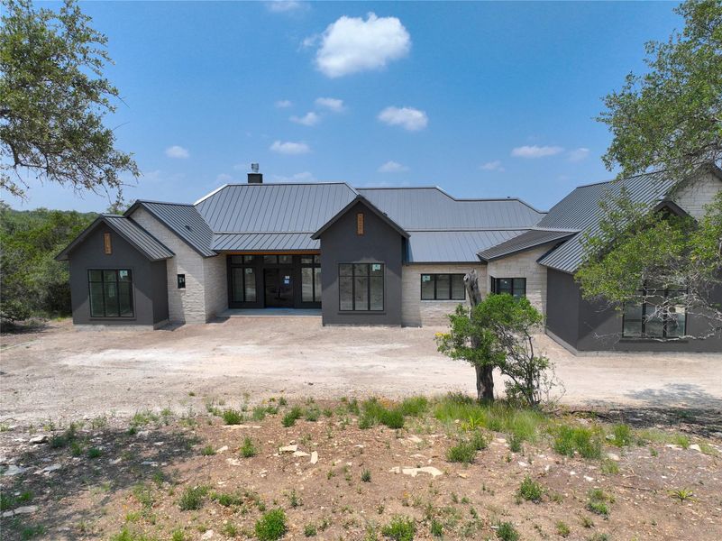 Front exterior of a new home in , Canyon Lake, TX, highlighting curb appeal (Image 13). Front exterior of a new home in , Canyon Lake, TX, highlighting curb appeal (Image 13).