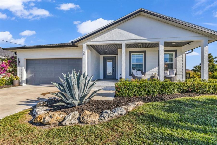 Front exterior of a new home in , Rotonda West, FL, highlighting curb appeal (Image 20). Front exterior of a new home in , Rotonda West, FL, highlighting curb appeal (Image 20).