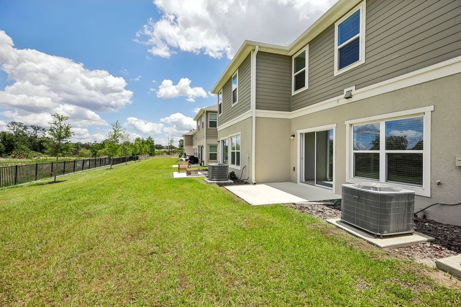 Exterior details and patio area of a home in Reserve at Forest Lake Townhomes, Lake Wales (Image 3).