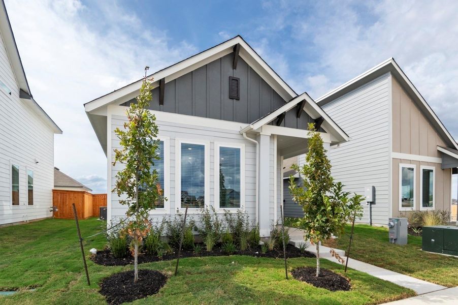 Front exterior of a new home in Trace, San Marcos, TX, highlighting curb appeal (Image 21).