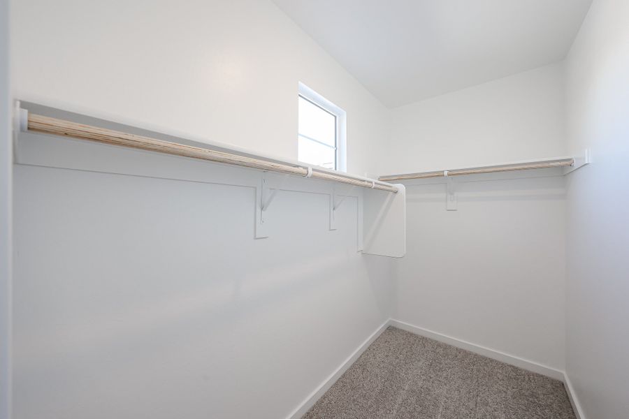 A white room with a window.