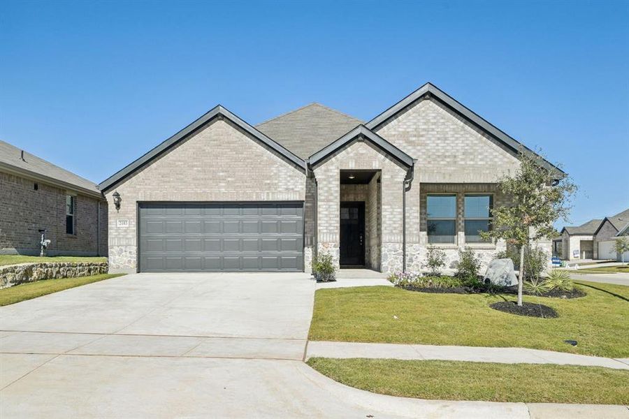 Front exterior of a new home in Westmoor, Sherman, TX, highlighting curb appeal (Image 1). Front exterior of a new home in Westmoor, Sherman, TX, highlighting curb appeal (Image 1).