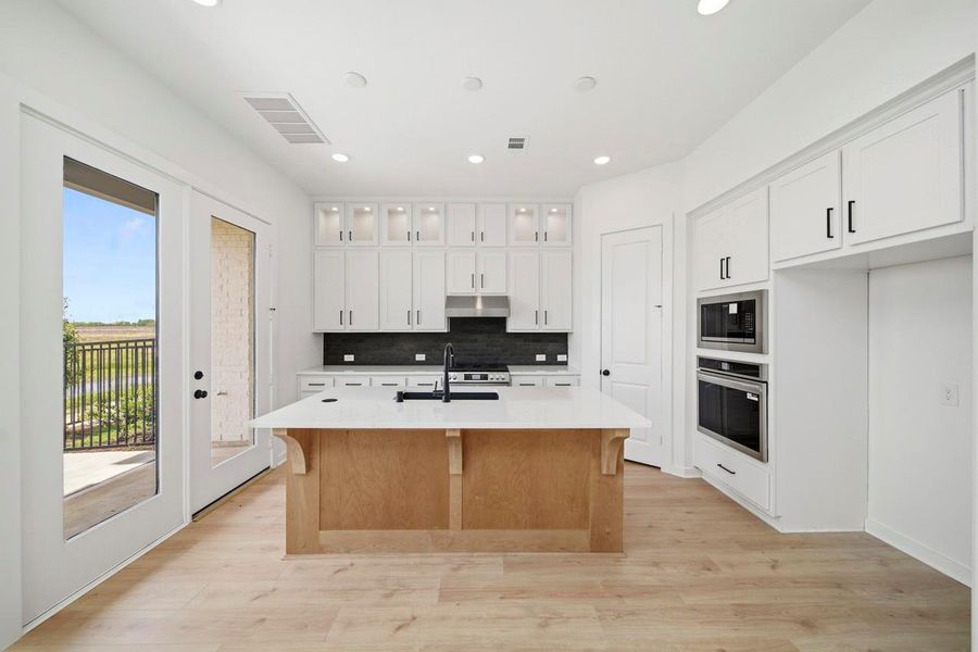 Furnished interior view inside a new home in Bridgeland, Cypress (Image 6).