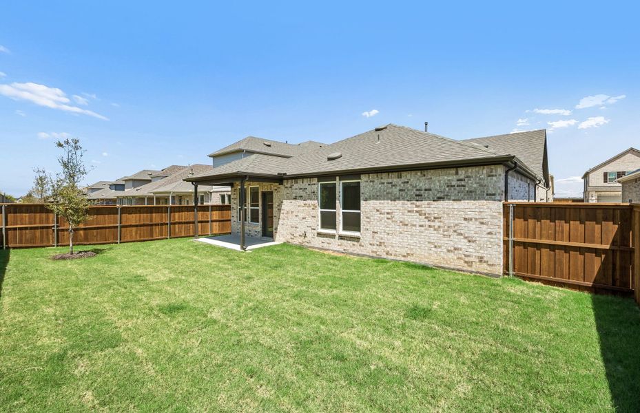 Exterior details and patio area of a home in Creekview Meadows, Pilot Point (Image 3).