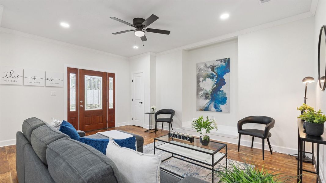 Recessed lighting throughout adds a clean, contemporary feel, while the built-in entertainment niche provides a practical focal point for media and storage.