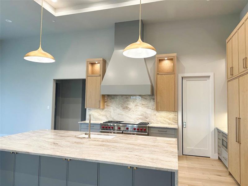 Beautiful pendant lights over large center island.