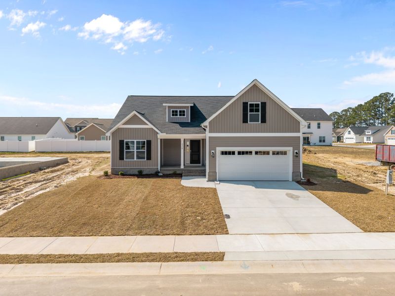 Front exterior of a new home in Davenport Farms, Winterville, NC, highlighting curb appeal (Image 21).