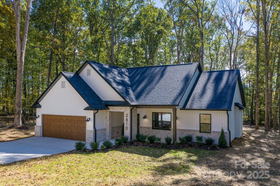 Front exterior of a new home in , Gastonia, NC, highlighting curb appeal (Image 21).