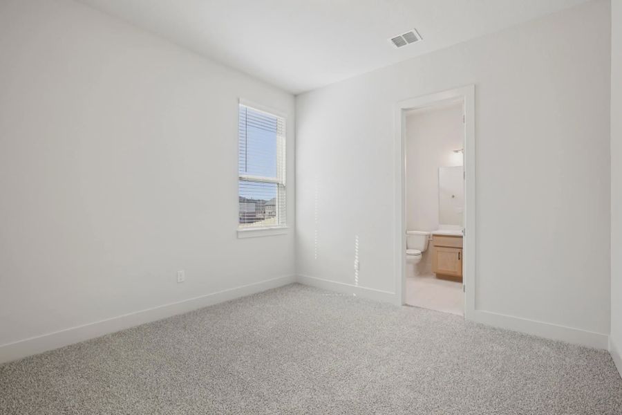Representative unfurnished interior of a home built from the Draco by Chesmar Homes in The Grove at Blackhawk, Pflugerville (Image 14).