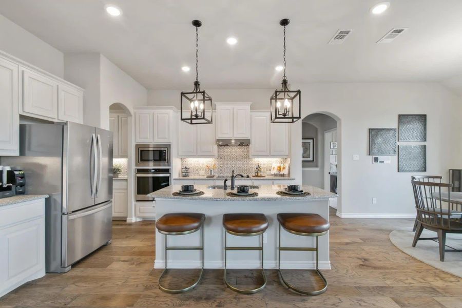 Kitchen | Concept 2434 at Coyote Crossing in Godley, TX by Landsea Homes