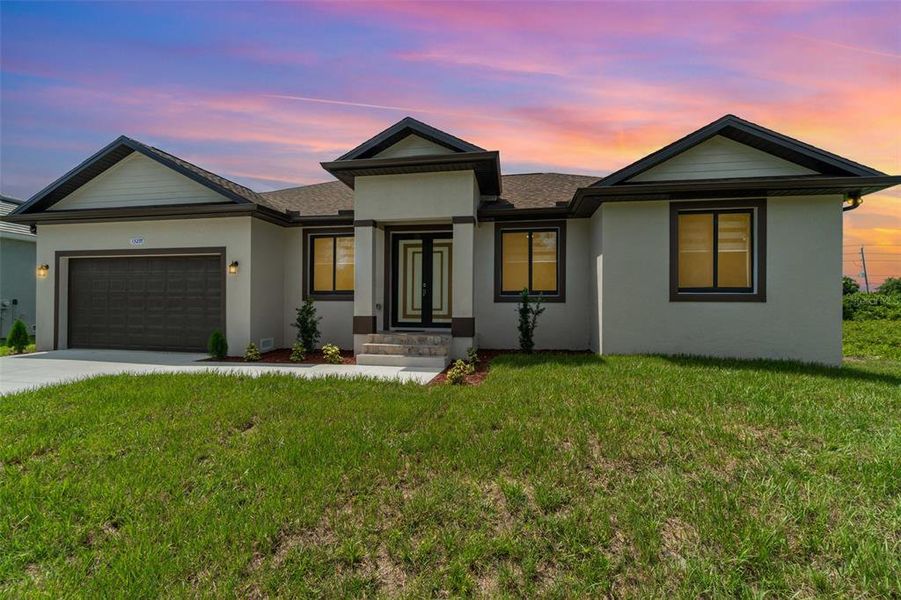 Front exterior of a new home in , Port Charlotte, FL, highlighting curb appeal (Image 20).