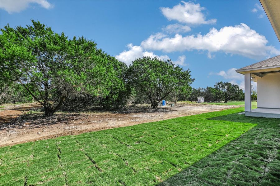 Front exterior of a new home in , Burnet, TX, highlighting curb appeal (Image 15).