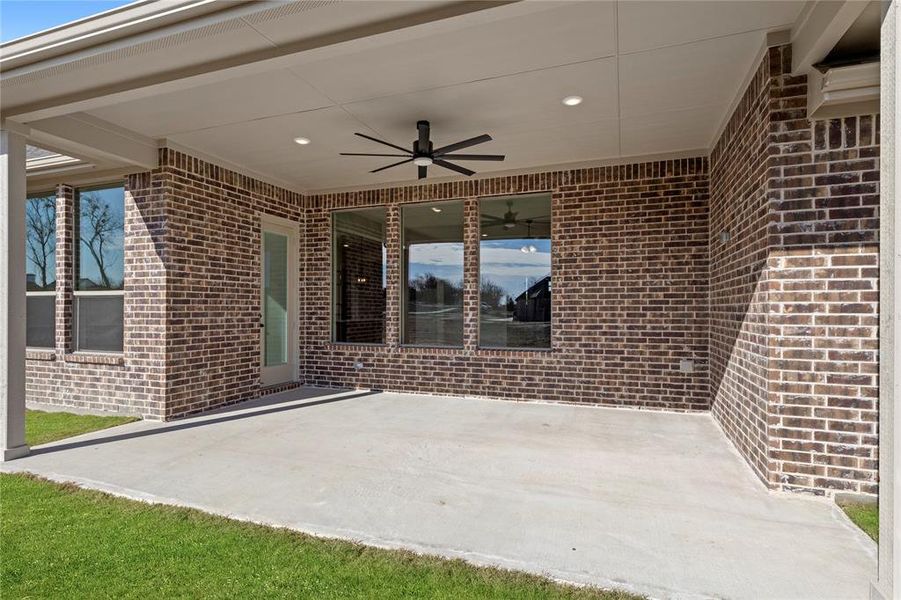 View of patio featuring ceiling fan