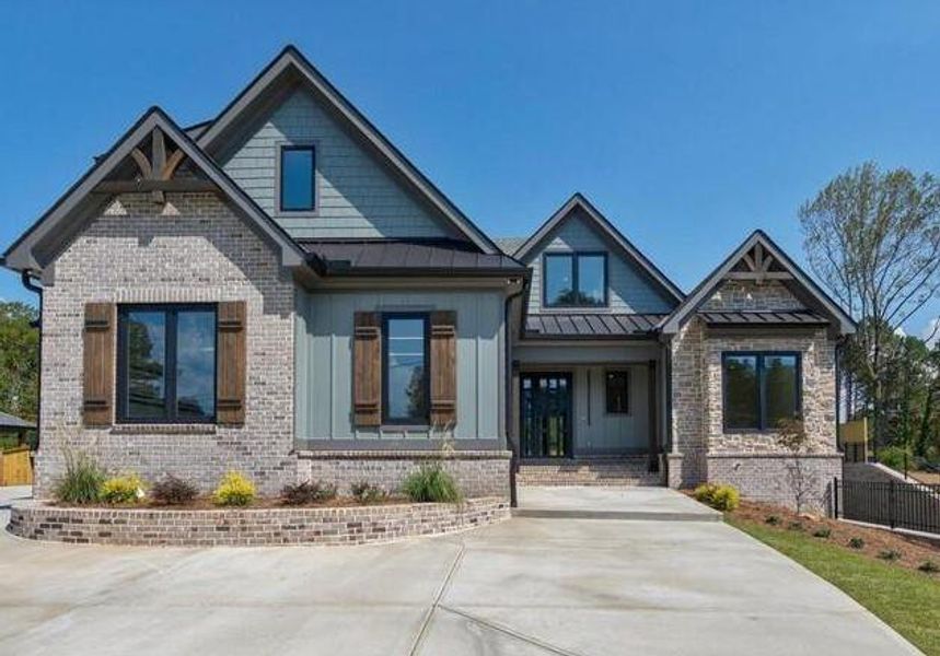 Front exterior of a new home in , Cumming, GA, highlighting curb appeal (Image 27).