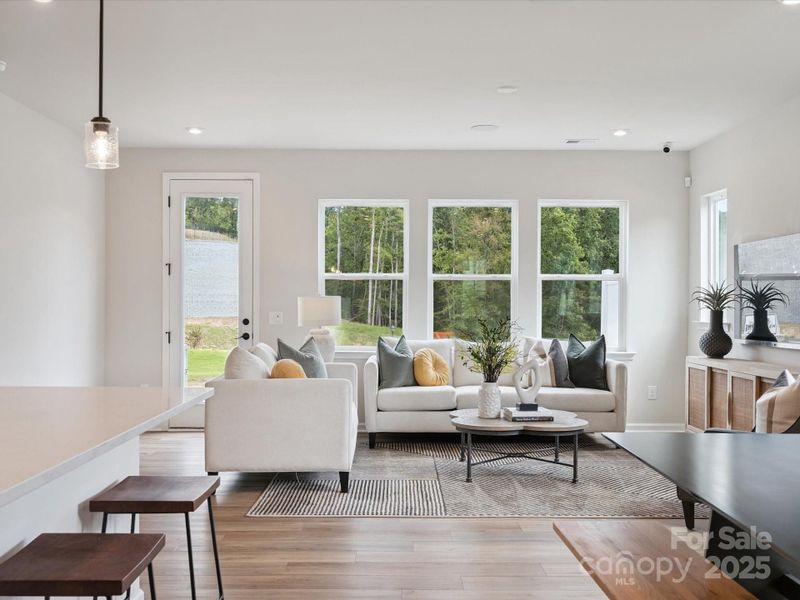 Great Room Leading to Outdoor Living.  *Model Photos | Actual Finishes, Structural Selections, and Orientation May Vary.