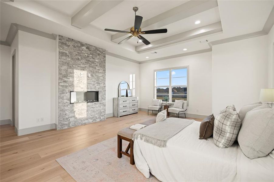Bedroom with light wood-type flooring, a fireplace, ceiling fan, and recessed lighting Bedroom with light wood-type flooring, a fireplace, ceiling fan, and recessed lighting