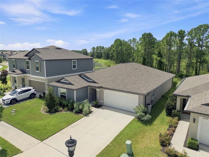 Front exterior of a new home in , Zephyrhills, FL, highlighting curb appeal (Image 25). Front exterior of a new home in , Zephyrhills, FL, highlighting curb appeal (Image 25).