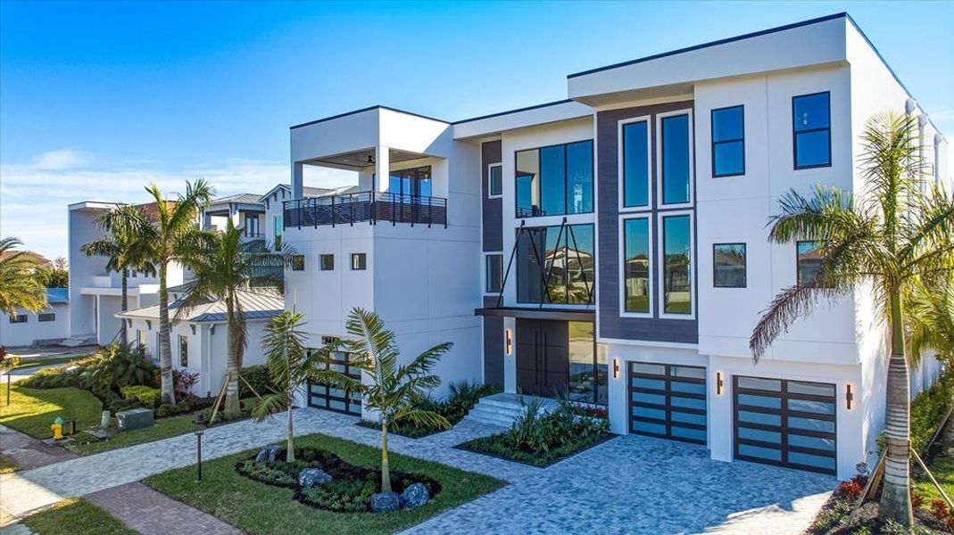 Front exterior of a new home in Legends Bay, Bradenton, FL, highlighting curb appeal (Image 23).